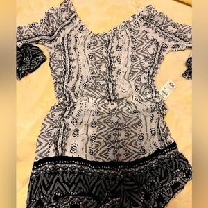 Women’s one piece shorts jumper.  Never worn.  Size small